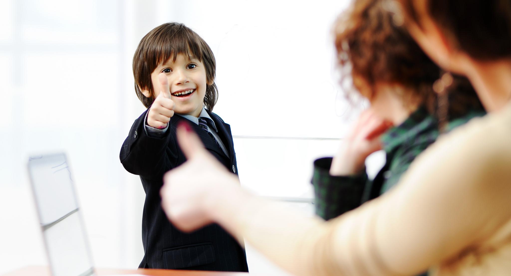 boy thumbs up and doing presantation