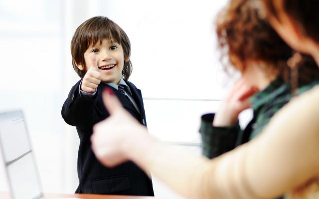 boy thumbs up and doing presantation